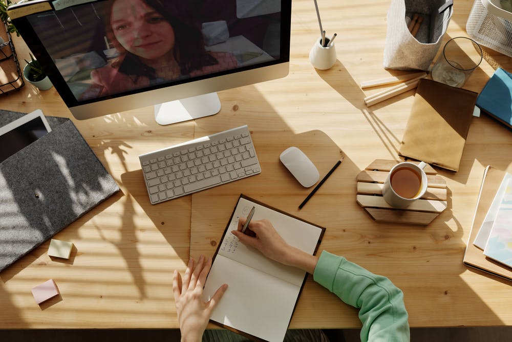 Computer screen and notebook